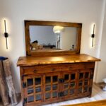 بوفيه خشبي ريفي بأبواب زجاجية مفرغة ومرآة مستطيلة (Rustic Glass-Panel Buffet with Wall Mirror)